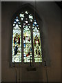 Stained glass window on the westwall of St Peter and St Paul, Wymering