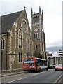 Bus passing The Wesley Centre in Queens Road